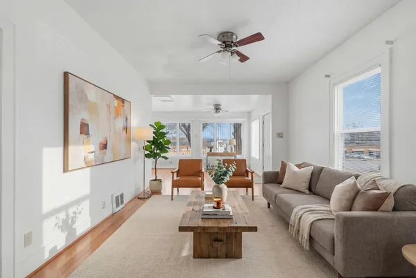 a living room with furniture and a large window
