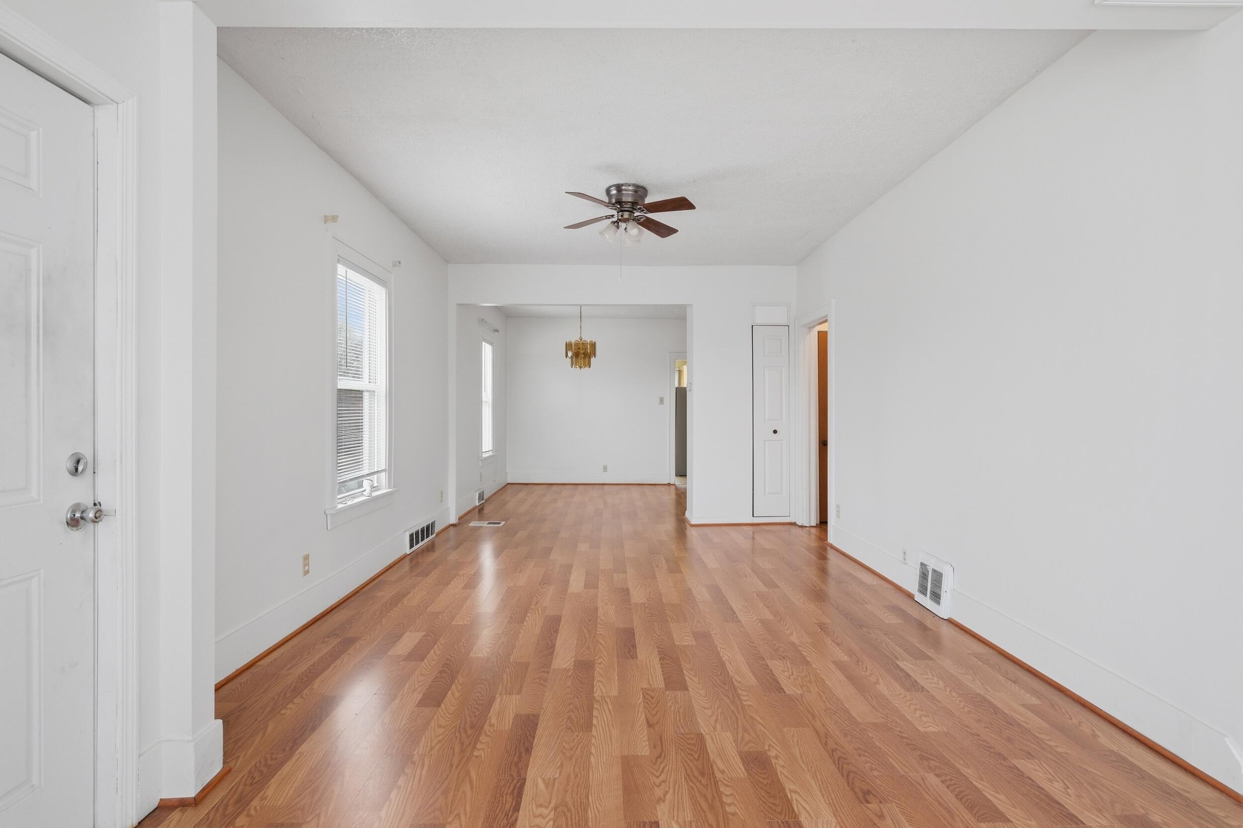 2418 Ridge Road Highland, IN 46322 - Photo 5 of 44 an empty room with wooden floor and ceiling fan