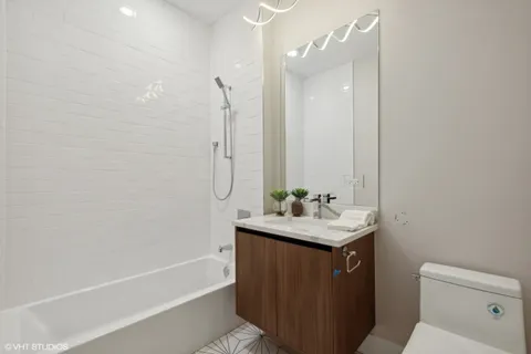 a view of a hallway with washer and dryer