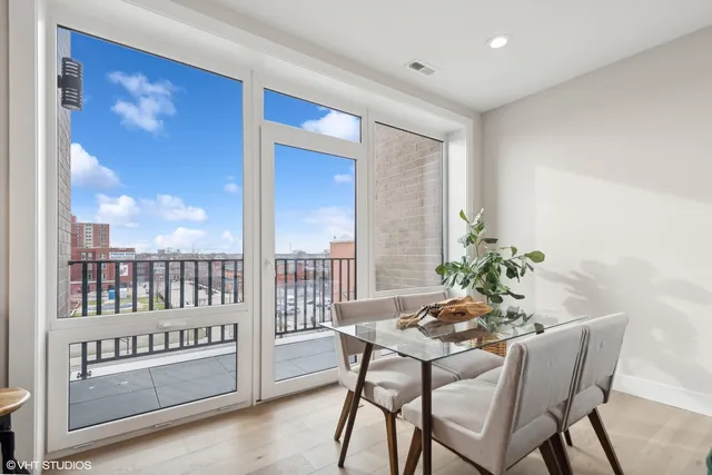a kitchen with stainless steel appliances granite countertop a sink a stove and a refrigerator