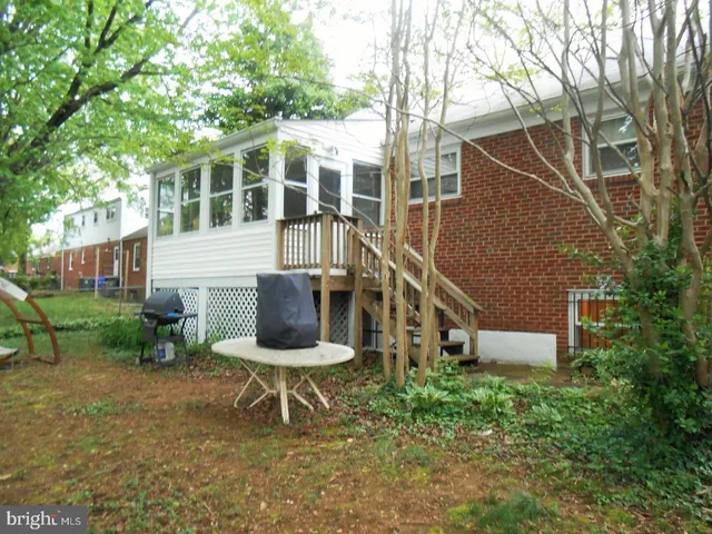 a front view of a house with wooden stairs