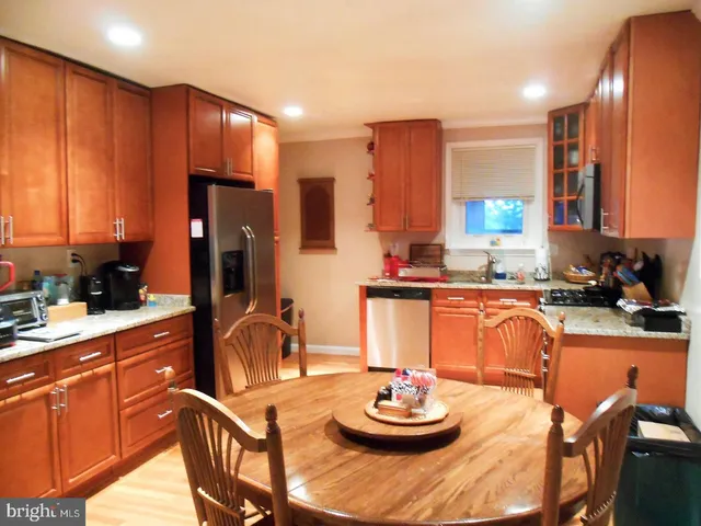 a kitchen with a appliances and cabinets