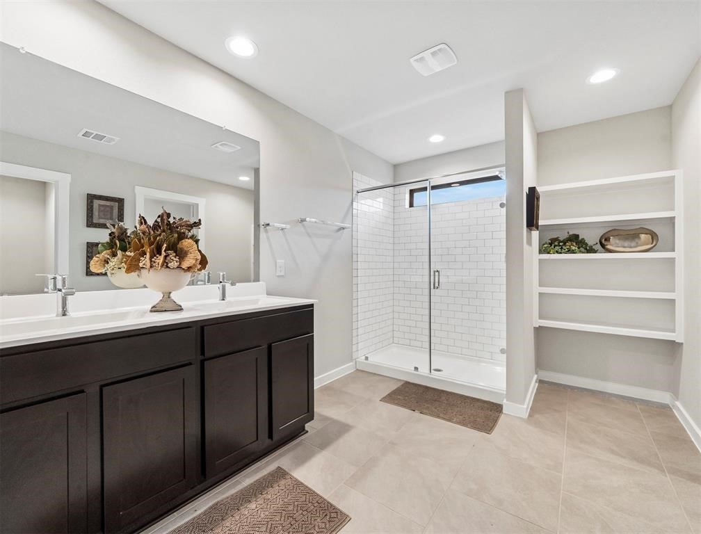 7922 Brumbly Lane Rosharon, TX 77583 - Photo 10 of 17 a bathroom with a double vanity sink mirror and double