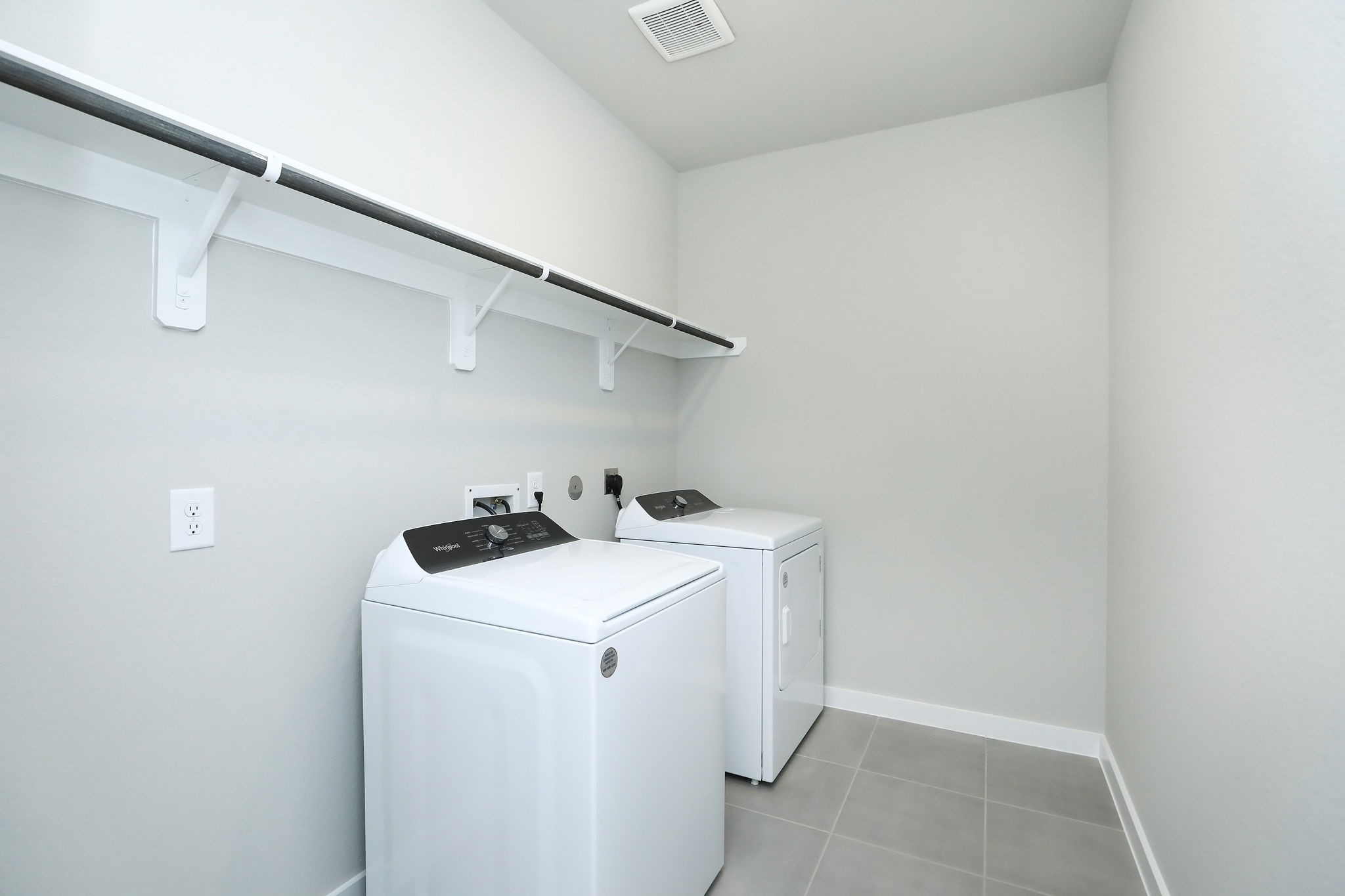 14110 Greystone Ter Street Magnolia, TX 77354 - Photo 20 of 34 Check Out The Spacious Laurdry Room With Plenty Of Hanger And Shelving Space. The Washer And Dryer Are Included As Part Of The Lease.