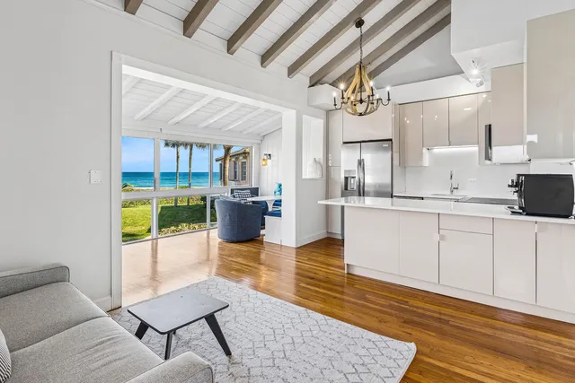a kitchen with stainless steel appliances kitchen island granite countertop a sink and cabinets