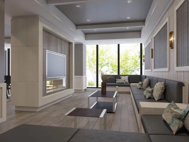 a living room with furniture and large windows