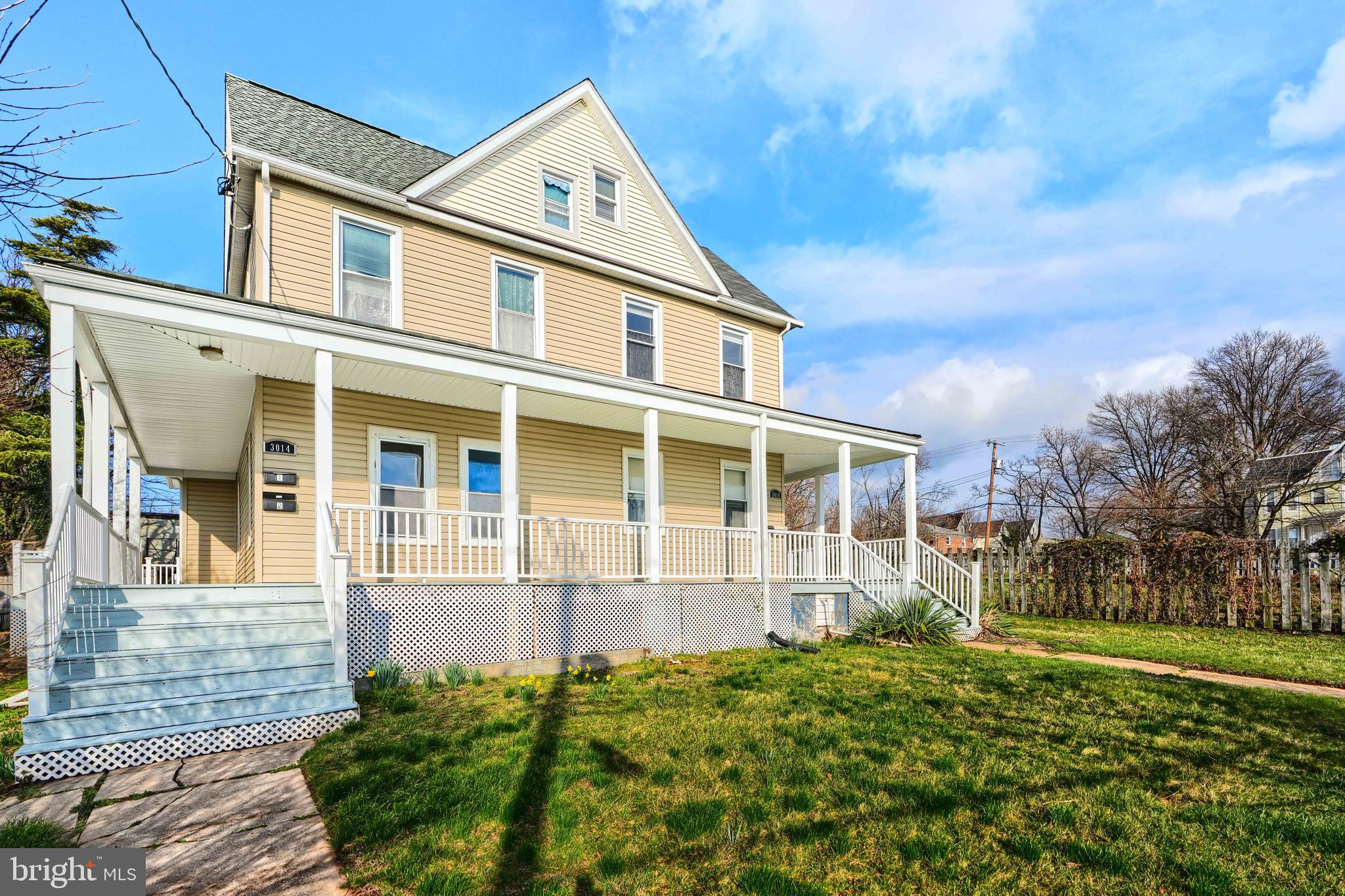 front view of a house with a yard