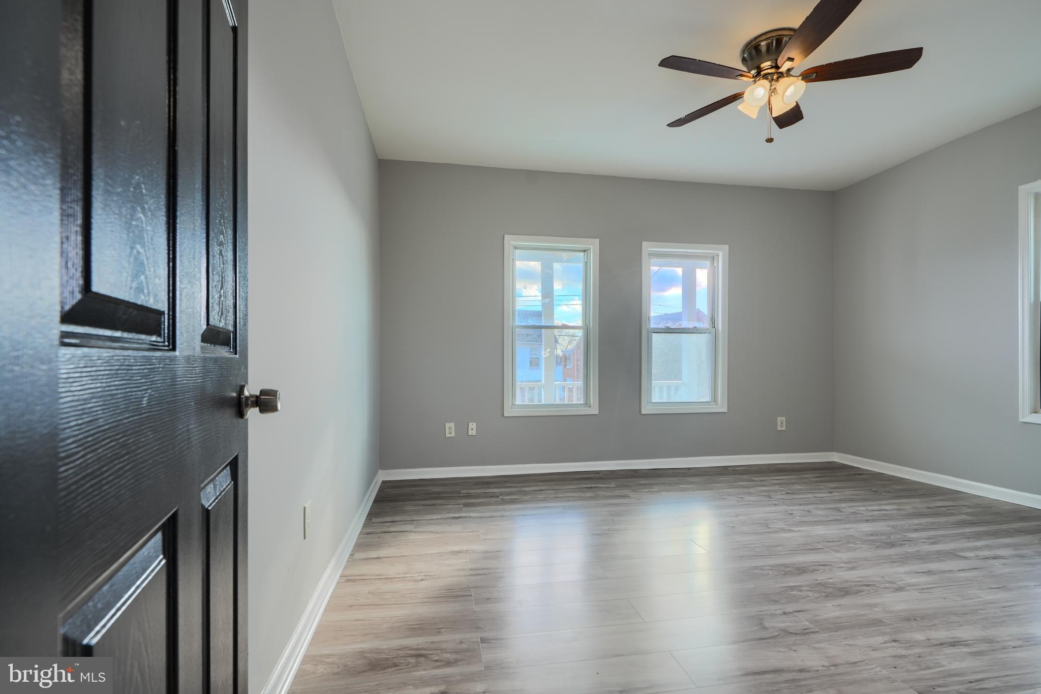 3014 Hamilton Avenue, Unit 1 Baltimore, MD 21214 - Photo 18 of 36 a view of room with window and hardwood floor