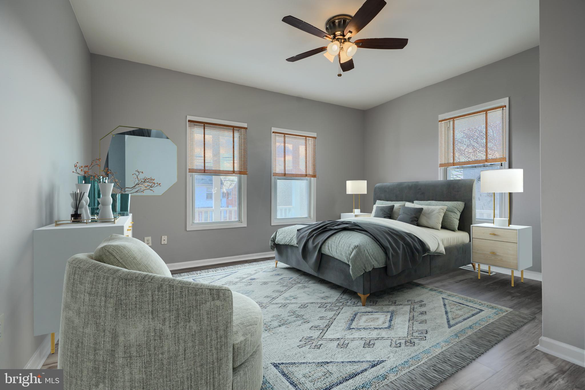 3014 Hamilton Avenue, Unit 1 Baltimore, MD 21214 - Photo 19 of 36 a spacious bedroom with a bed couch and window