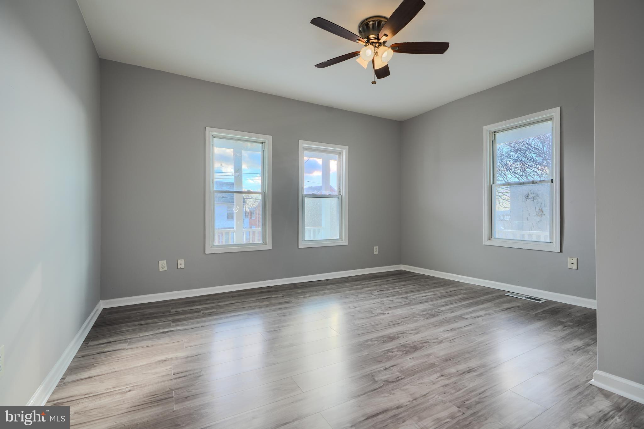 3014 Hamilton Avenue, Unit 1 Baltimore, MD 21214 - Photo 20 of 36 a view of empty room with wooden floor and fan