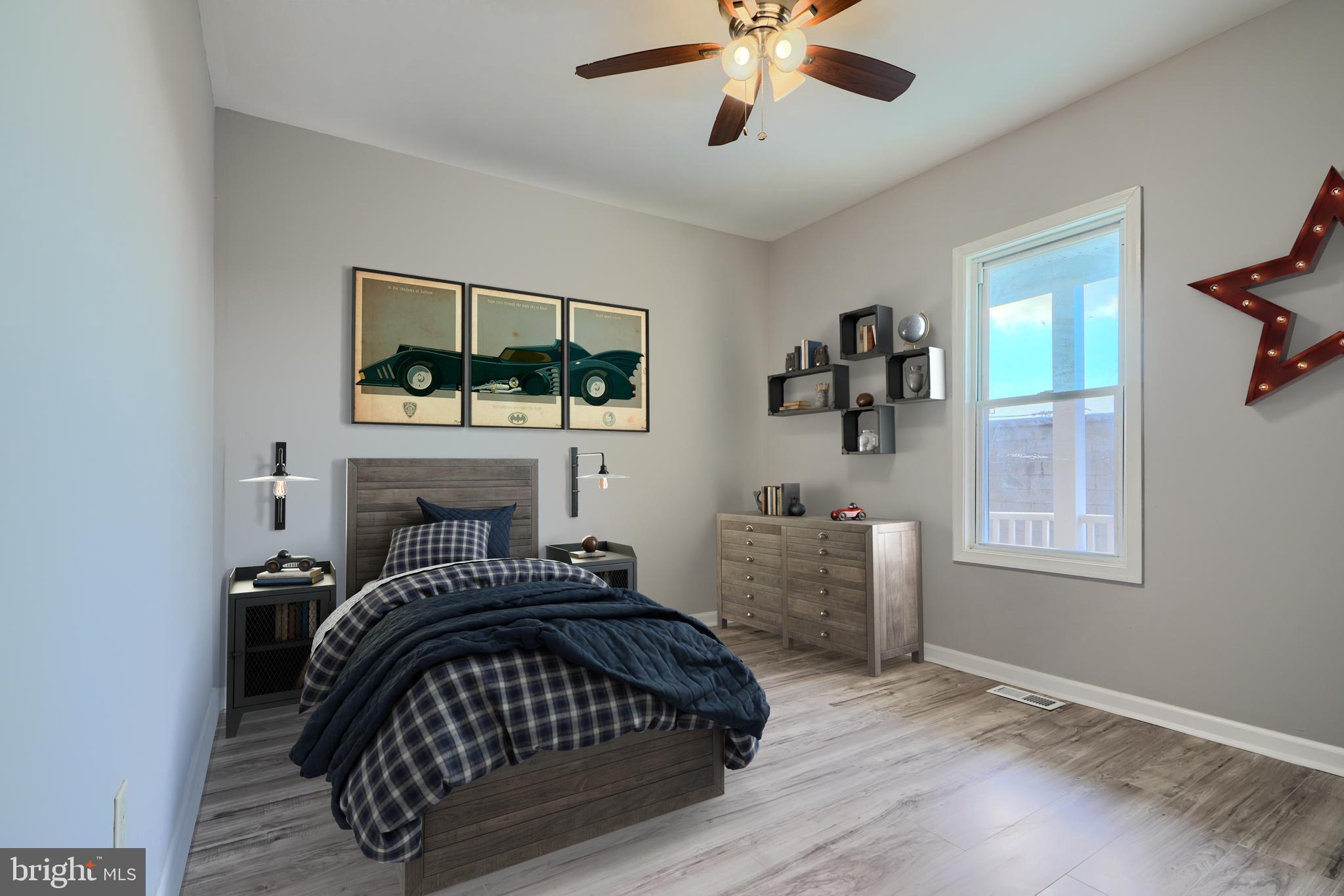 3014 Hamilton Avenue, Unit 1 Baltimore, MD 21214 - Photo 24 of 36 a bedroom with a bed and a chandelier