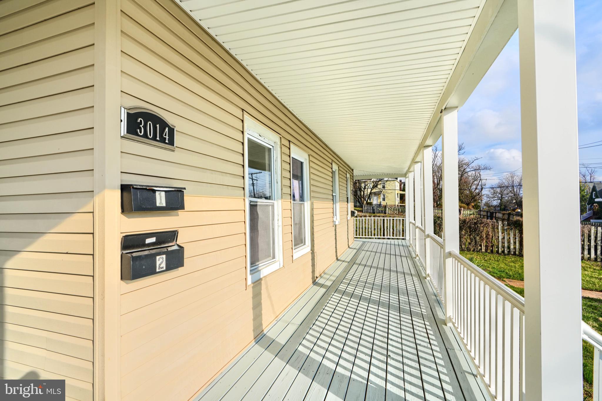 3014 Hamilton Avenue, Unit 1 Baltimore, MD 21214 - Photo 4 of 36 a view of a balcony with wooden floor