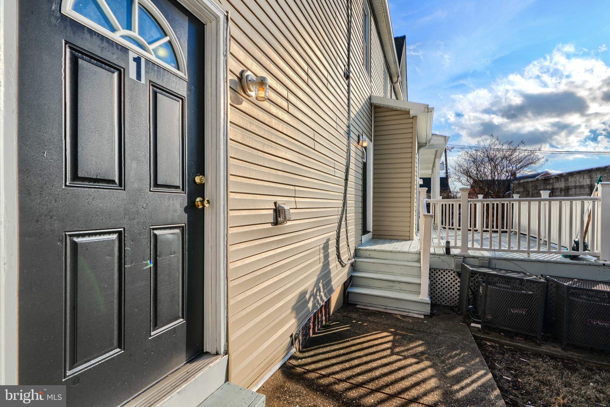 3014 Hamilton Avenue, Unit 1 Baltimore, MD 21214 - Photo 5 of 36 a view of a house with a door and a porch