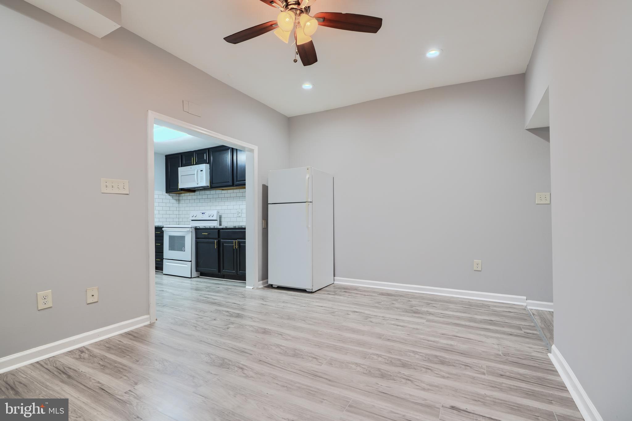 3014 Hamilton Avenue, Unit 1 Baltimore, MD 21214 - Photo 7 of 36 a view of a livingroom with a flat screen tv