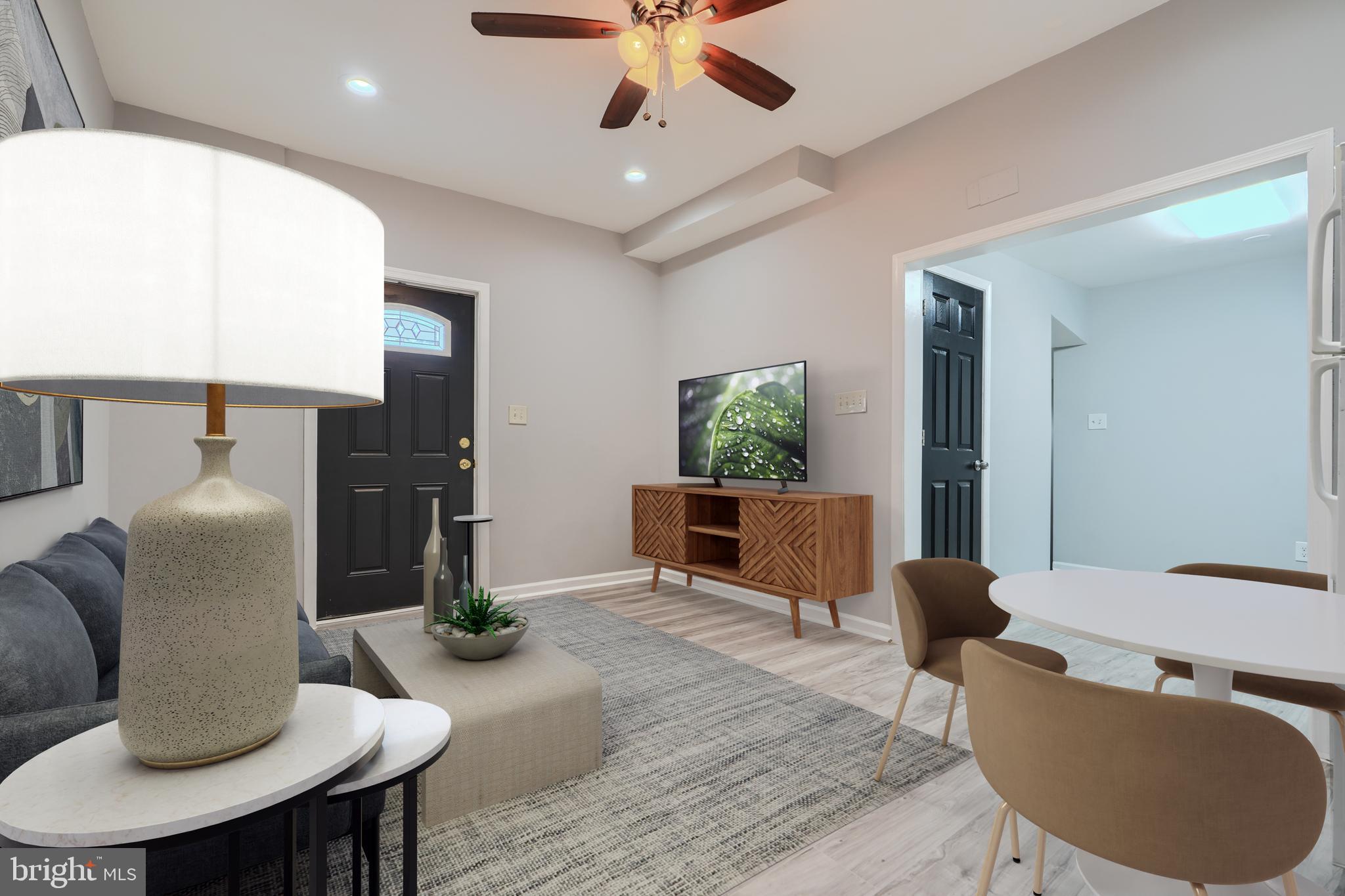 3014 Hamilton Avenue, Unit 1 Baltimore, MD 21214 - Photo 8 of 36 a living room with furniture and a window