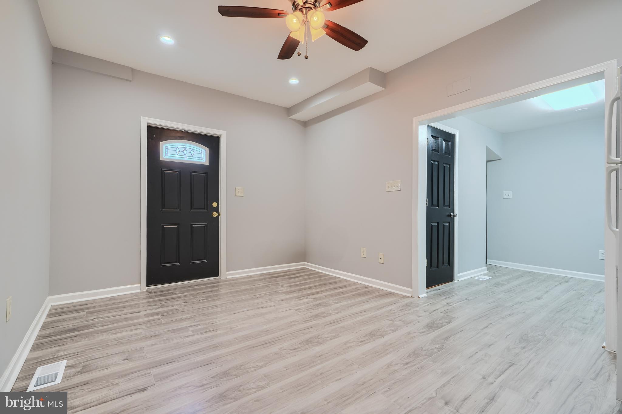 3014 Hamilton Avenue, Unit 1 Baltimore, MD 21214 - Photo 9 of 36 a view of an empty room with wooden floor