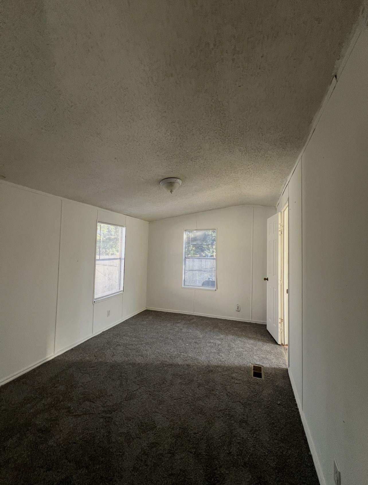 1511-4 Jones Street, Unit 4 Rosenberg, TX 77471 - Photo 10 of 11 an empty room with windows