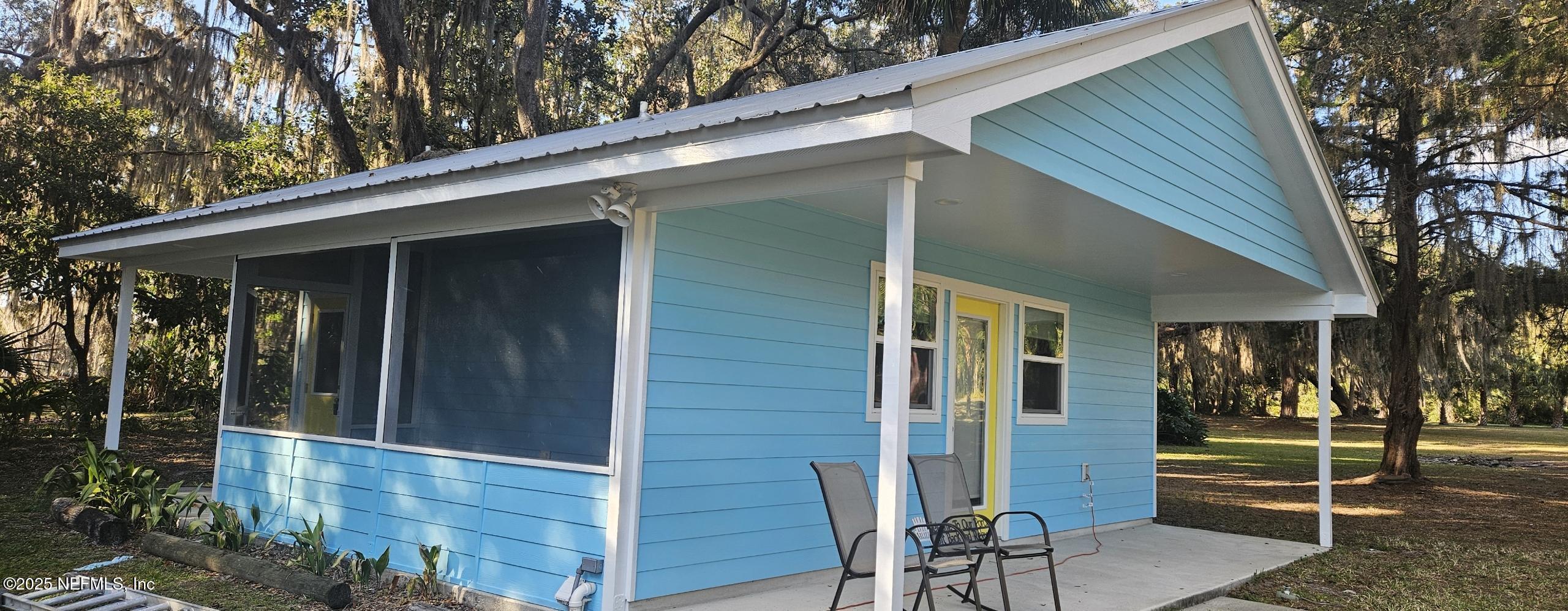 1521 County Road 309, Unit 1 Georgetown, FL 32139 - Photo 2 of 10 a view of house with backyard space and porch