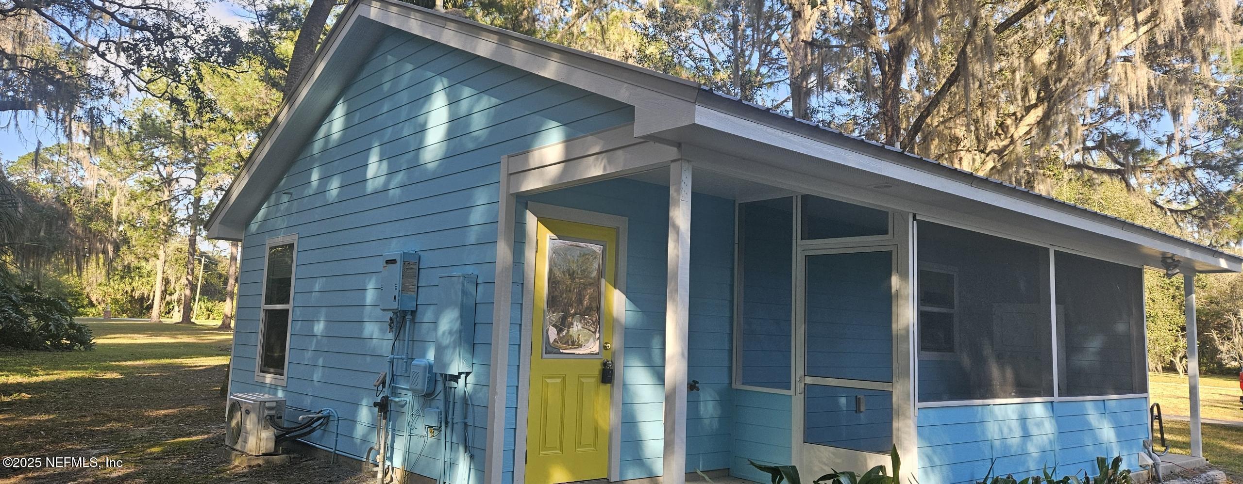 1521 County Road 309, Unit 1 Georgetown, FL 32139 - Photo 3 of 10 a view of a house with a tree