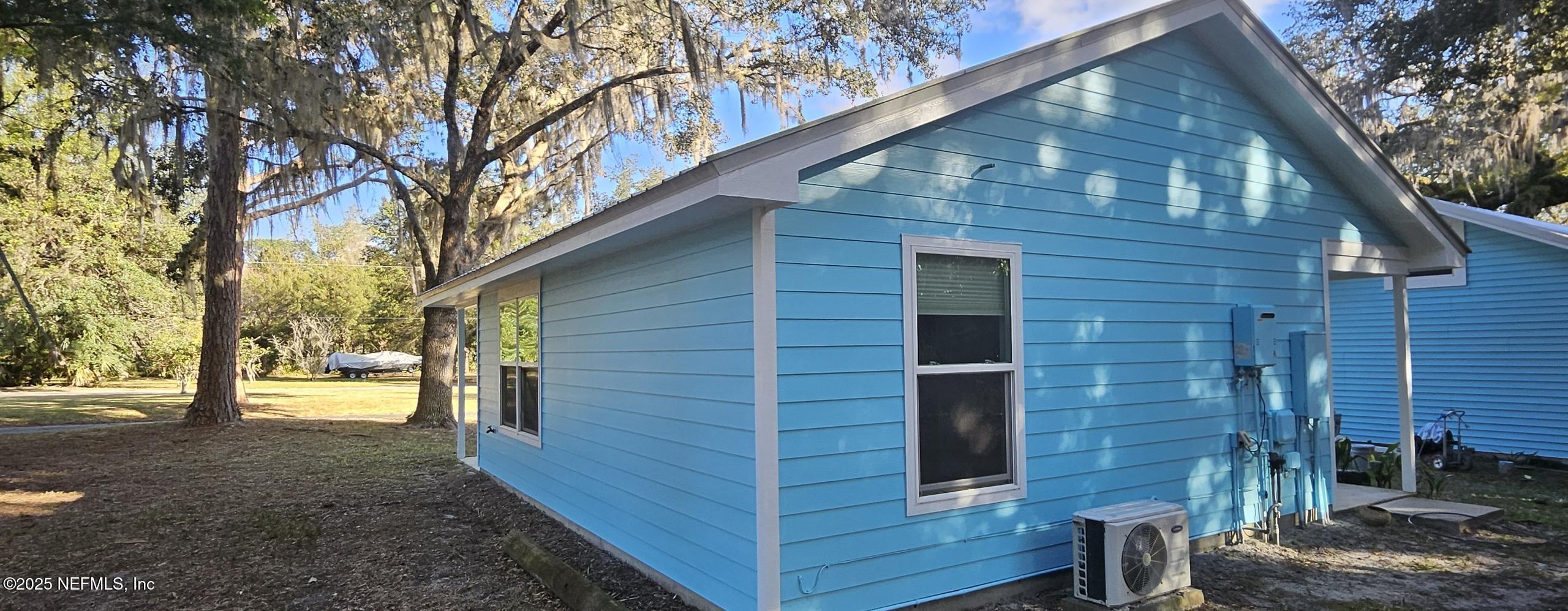 1521 County Road 309, Unit 1 Georgetown, FL 32139 - Photo 4 of 10 a view of a house with a yard