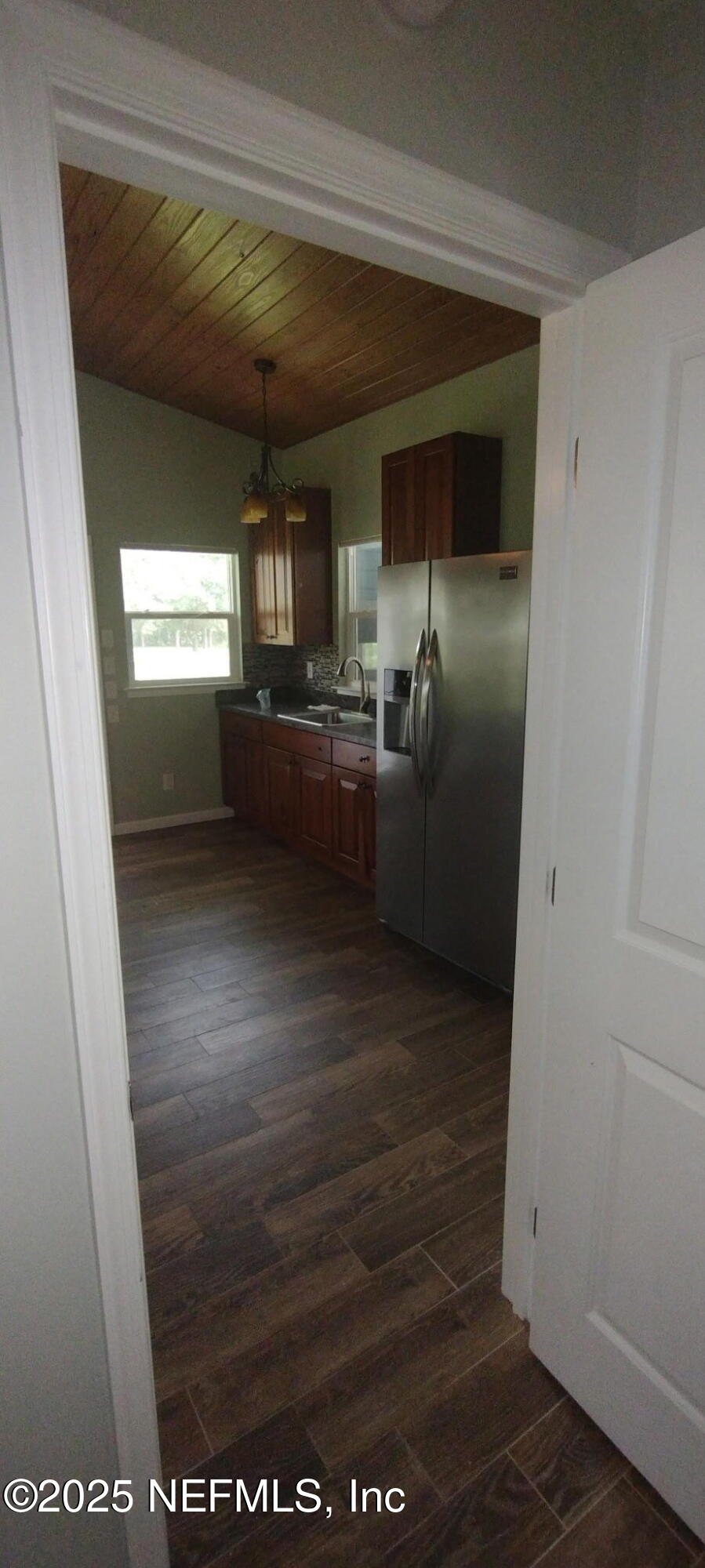 1521 County Road 309, Unit 1 Georgetown, FL 32139 - Photo 6 of 10 a view of kitchen and front door