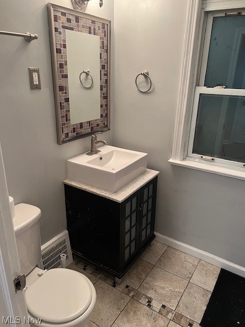 13623 Thraves Road Garfield Heights, OH 44125 - Photo 8 of 23 Bathroom with large vanity, toilet, and tile flooring