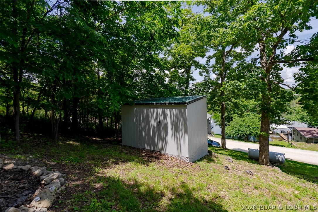 2486 Lick Creek Road Edwards, MO 65326 - Photo 23 of 39 storage shed