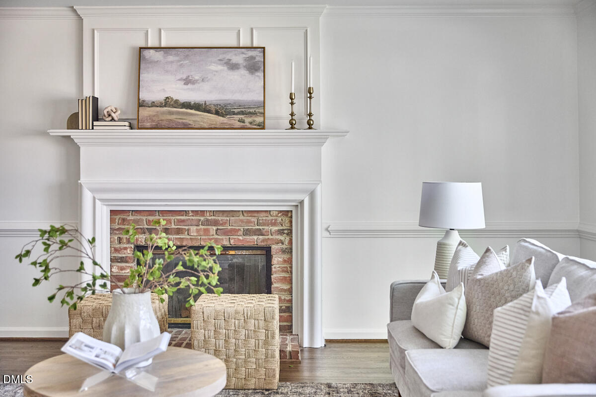 5220 Oakbrook Drive Durham, NC 27713 - Photo 17 of 38 a living room with furniture and a fireplace