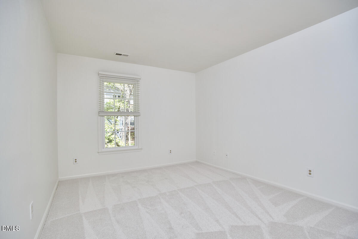 5220 Oakbrook Drive Durham, NC 27713 - Photo 26 of 38 an empty room with a window