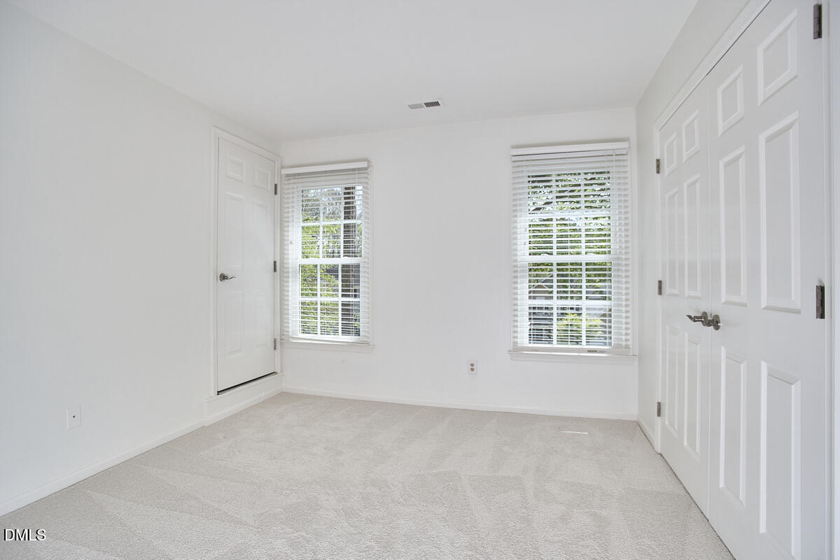 5220 Oakbrook Drive Durham, NC 27713 - Photo 27 of 38 an empty room with windows
