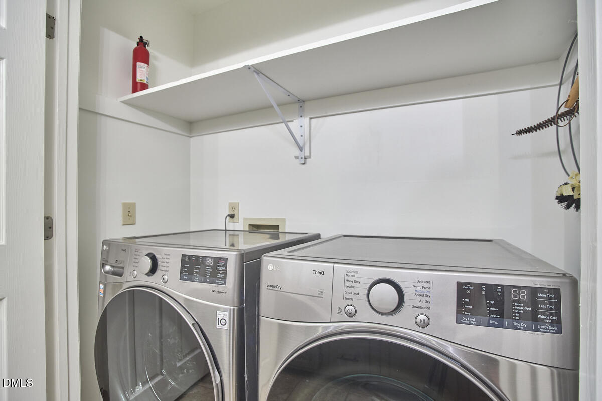 5220 Oakbrook Drive Durham, NC 27713 - Photo 29 of 38 a utility room with dryer and washer