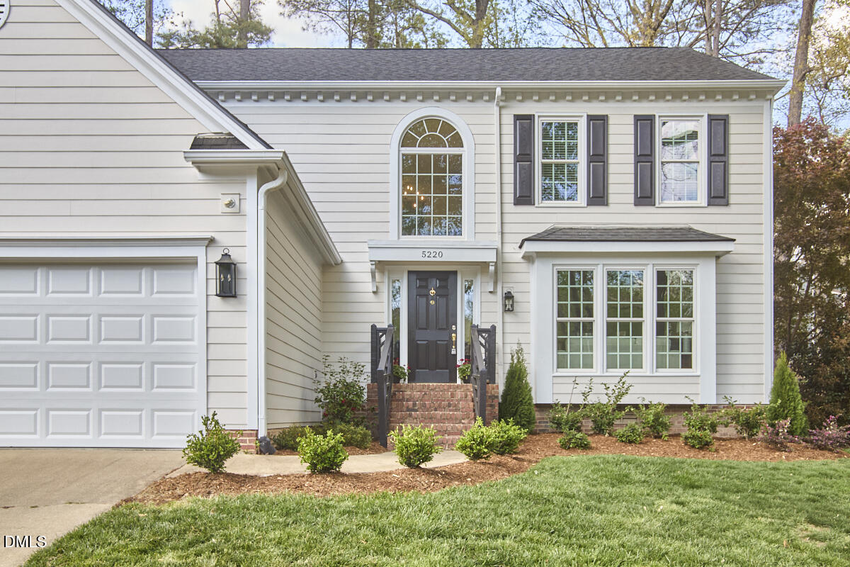 5220 Oakbrook Drive Durham, NC 27713 - Photo 2 of 38 a front view of a house