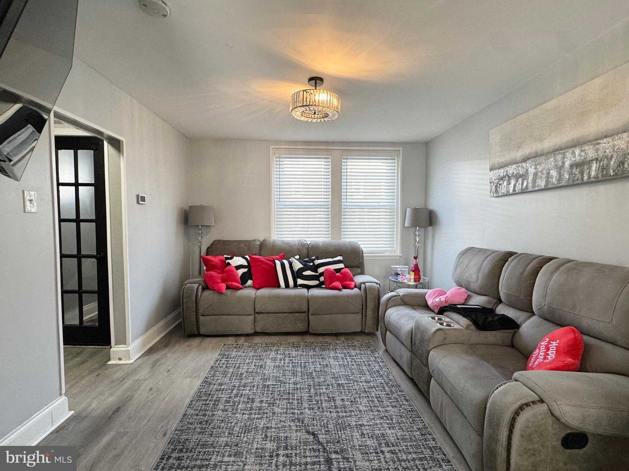 2931 North Constitution Road Camden, NJ 08104 - Photo 3 of 12 a living room with furniture and a window