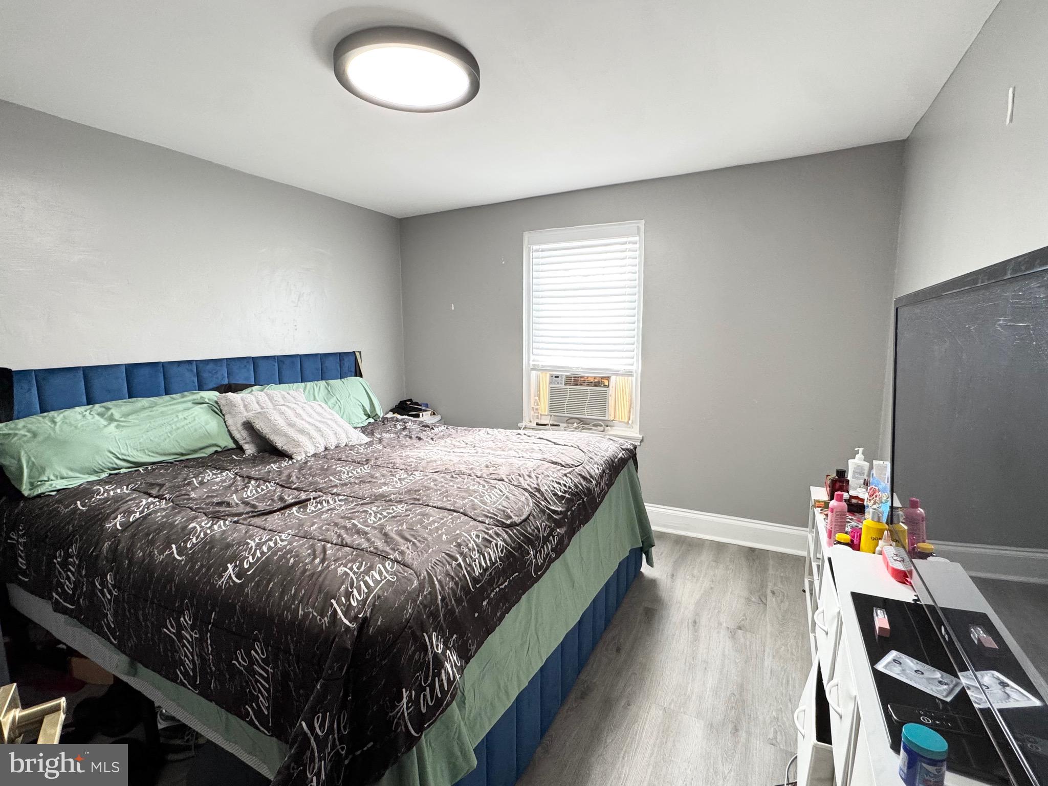 2931 North Constitution Road Camden, NJ 08104 - Photo 9 of 12 a bed sitting in a bedroom next to a window