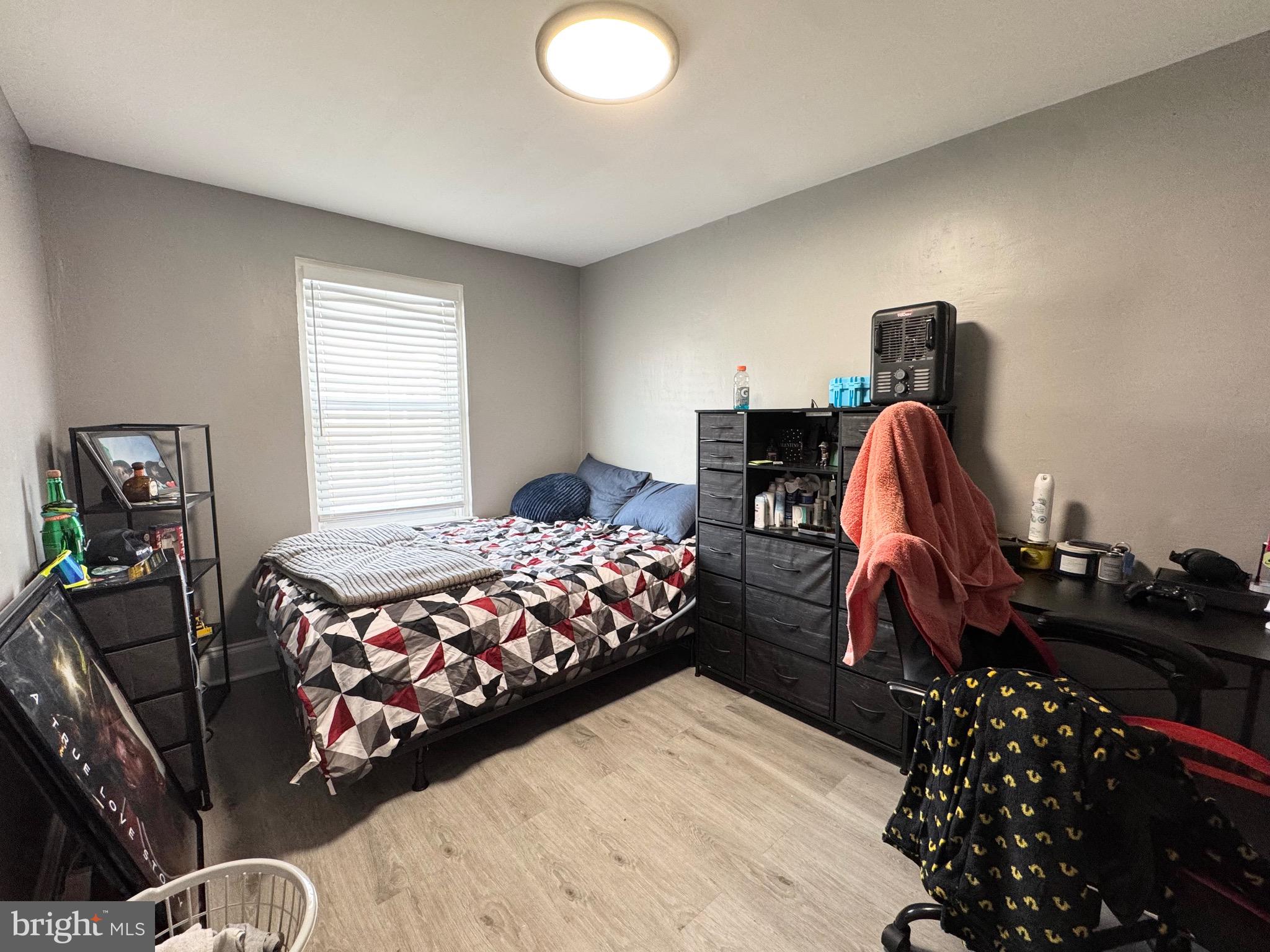 2931 North Constitution Road Camden, NJ 08104 - Photo 10 of 12 a bedroom with a bed and wooden floor