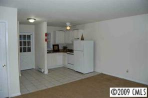 4218 Castleton Road Charlotte, NC 28211 - Photo 2 of 3 a view of a kitchen with refrigerator and windows
