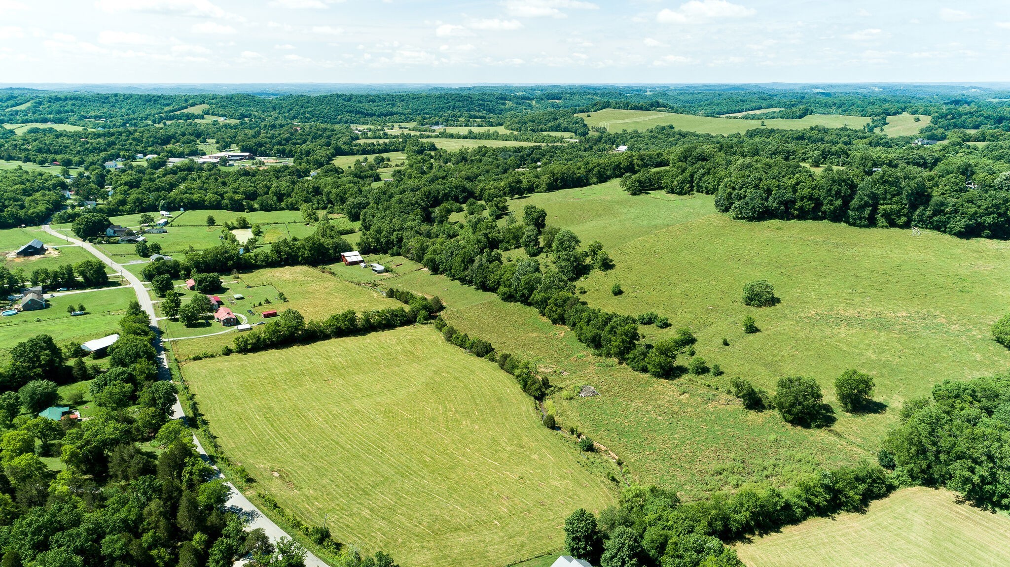 0 Fly Road Santa Fe, TN 38482 - Photo 6 of 15 an aerial view of residential houses with outdoor space and trees all around