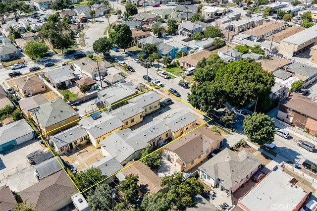 an aerial view of residential houses with outdoor space