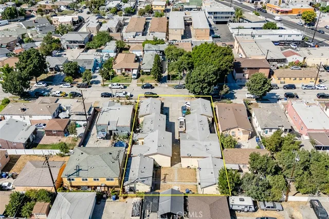 an aerial view of residential houses with outdoor space