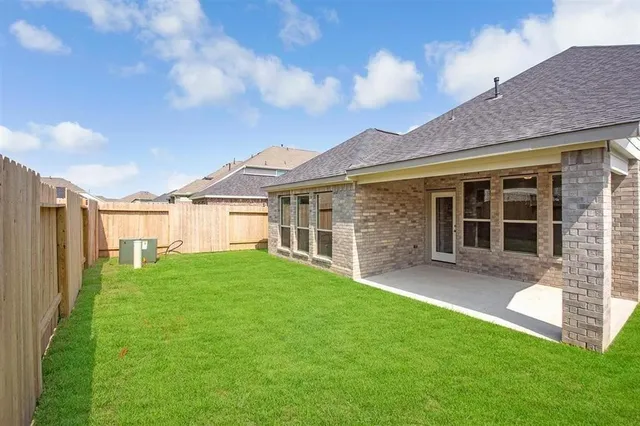 a view of a yard in front of a house