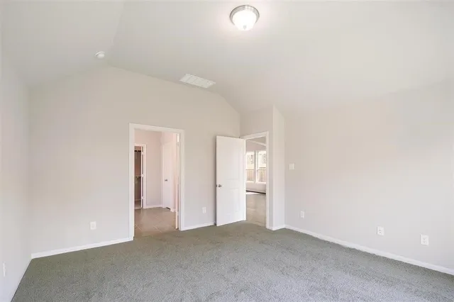 an empty room with closet area