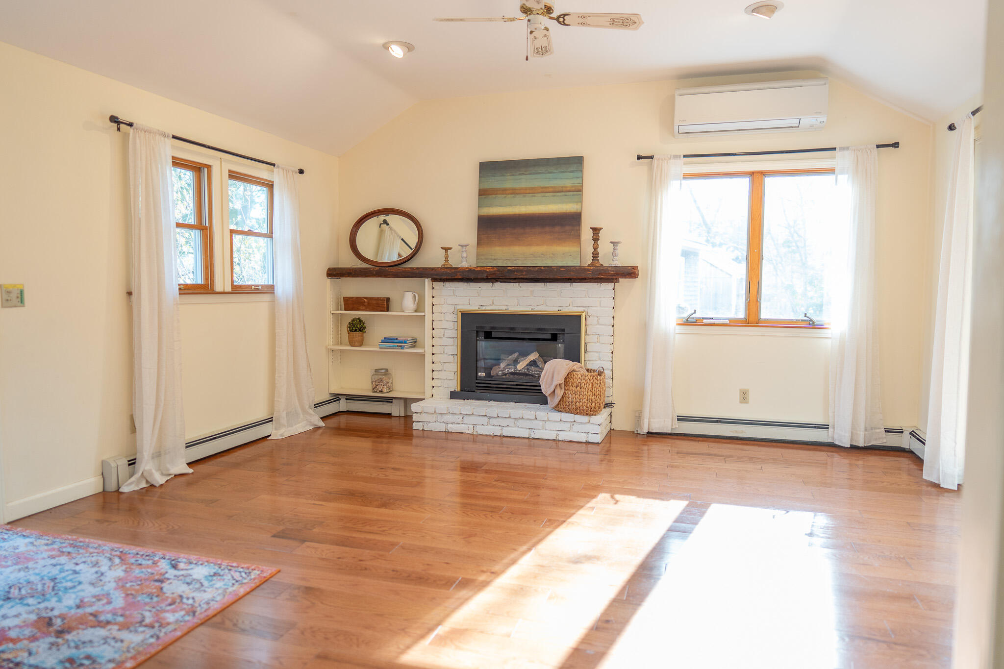 147 Brook Trail Road Brewster, MA 02631 - Photo 11 of 43 a view of an empty room with window and fire place