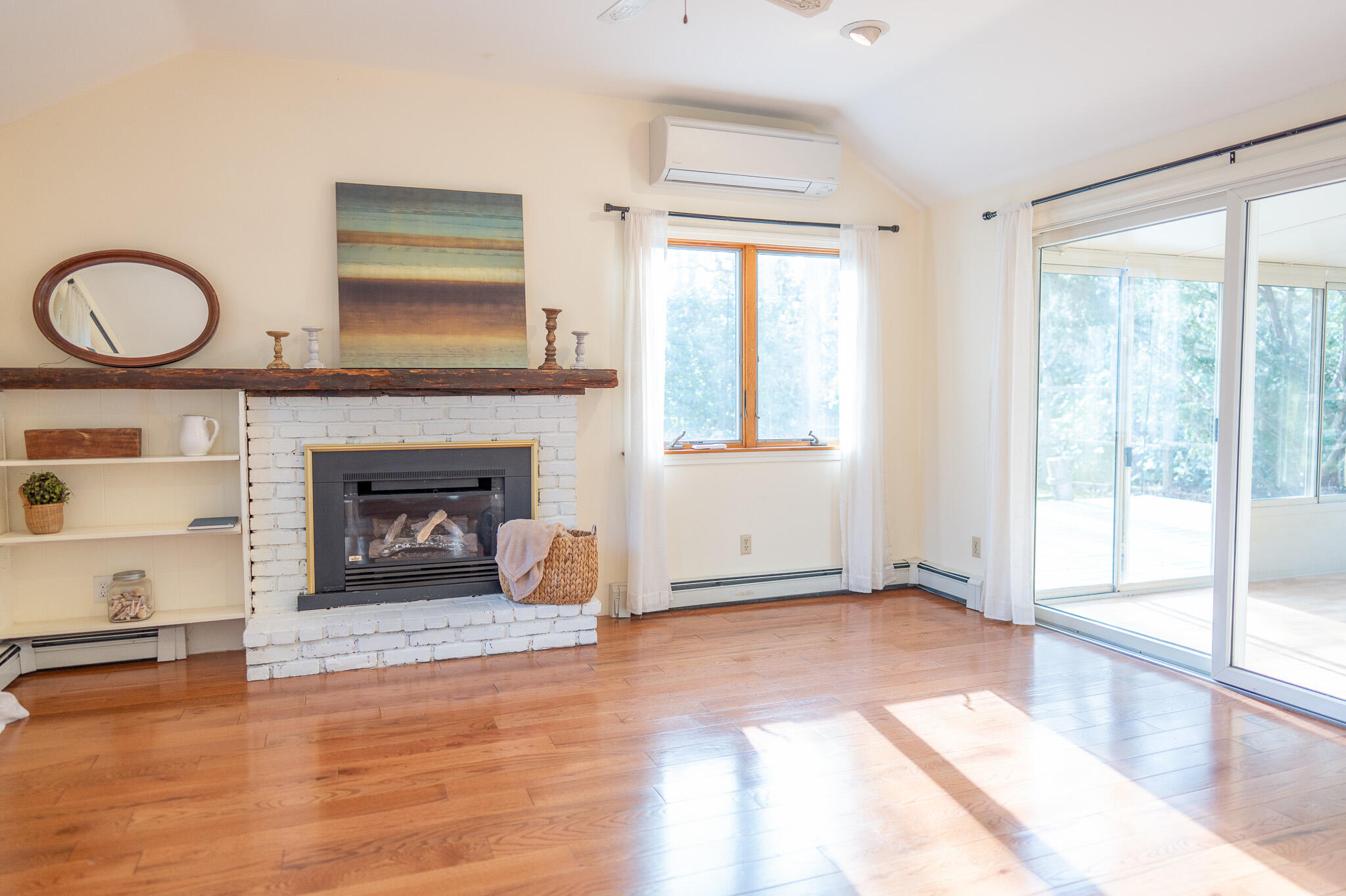 147 Brook Trail Road Brewster, MA 02631 - Photo 12 of 43 a view of an empty room with glass door and wooden floor
