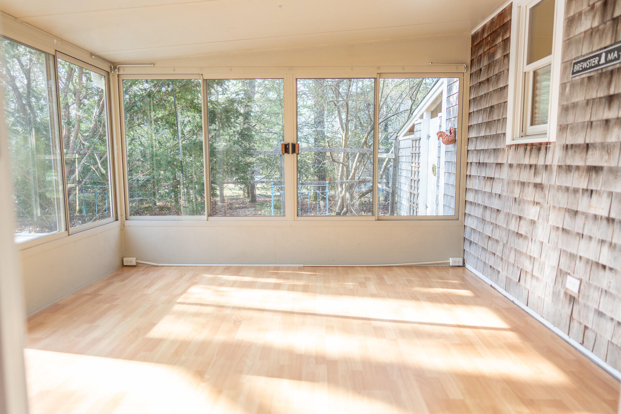 147 Brook Trail Road Brewster, MA 02631 - Photo 14 of 43 a view of an empty room with a window