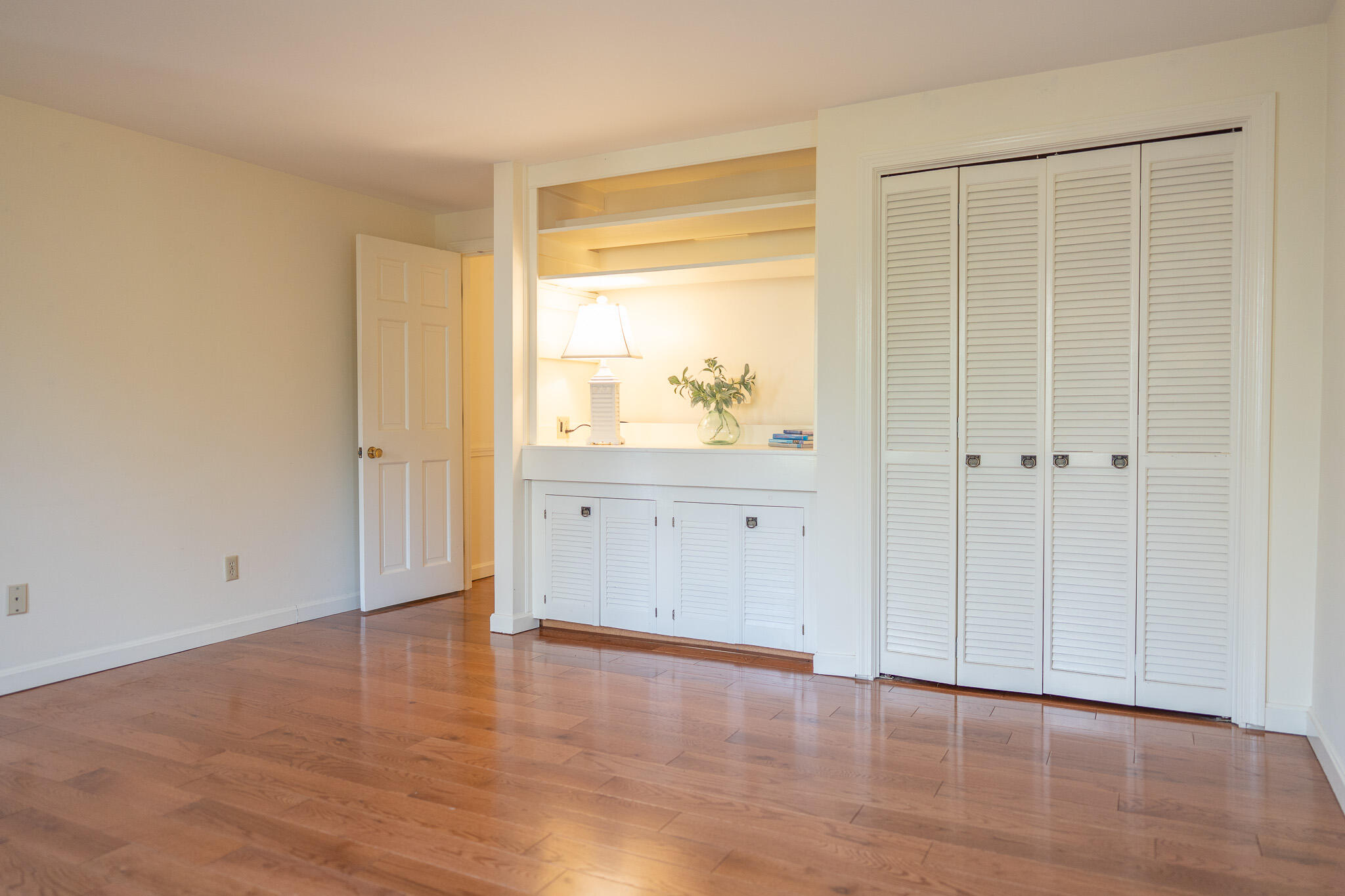 147 Brook Trail Road Brewster, MA 02631 - Photo 18 of 43 a view of an empty room with wooden floor and a window