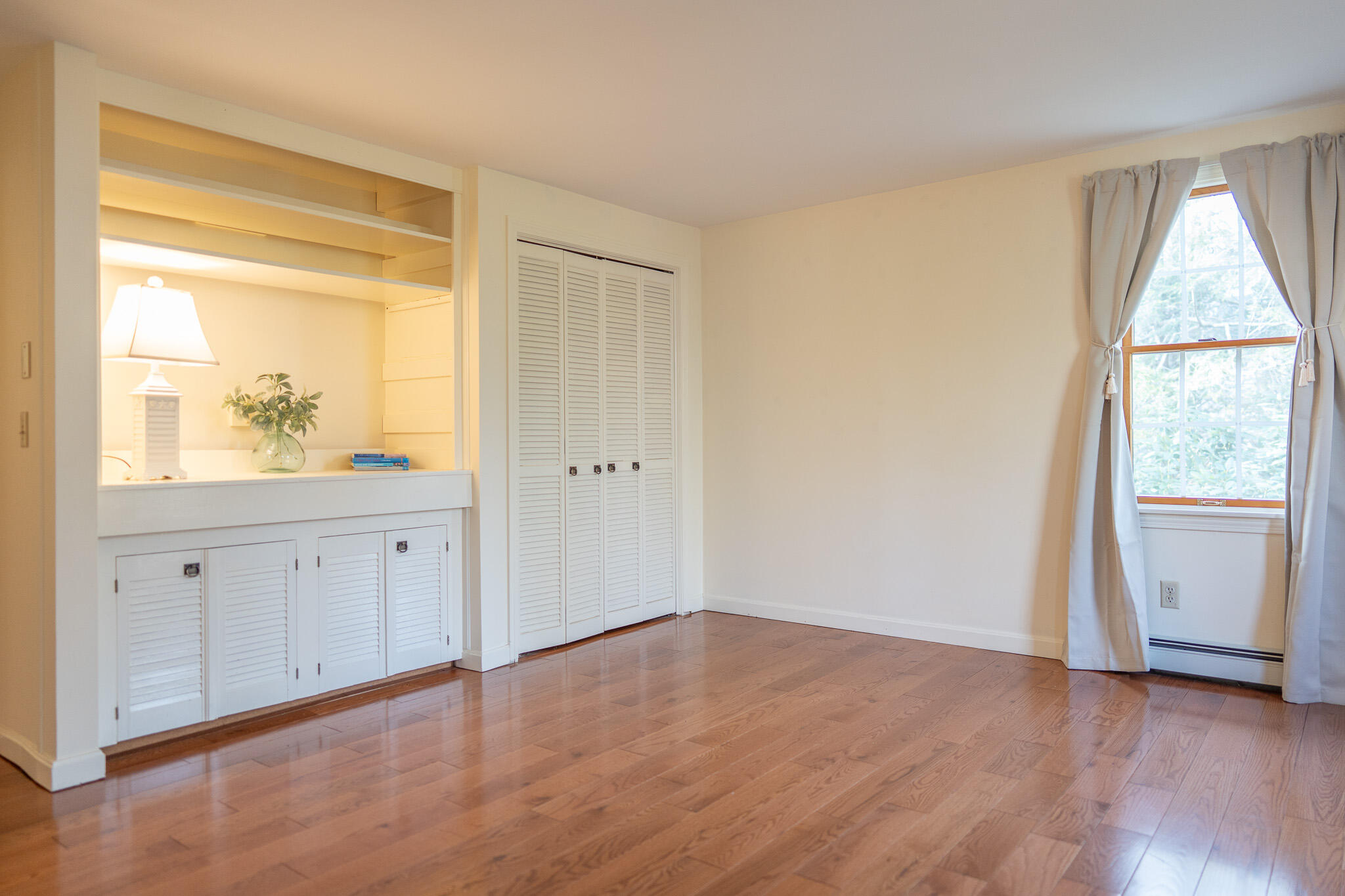 147 Brook Trail Road Brewster, MA 02631 - Photo 19 of 43 a view of an empty room with wooden floor and a window
