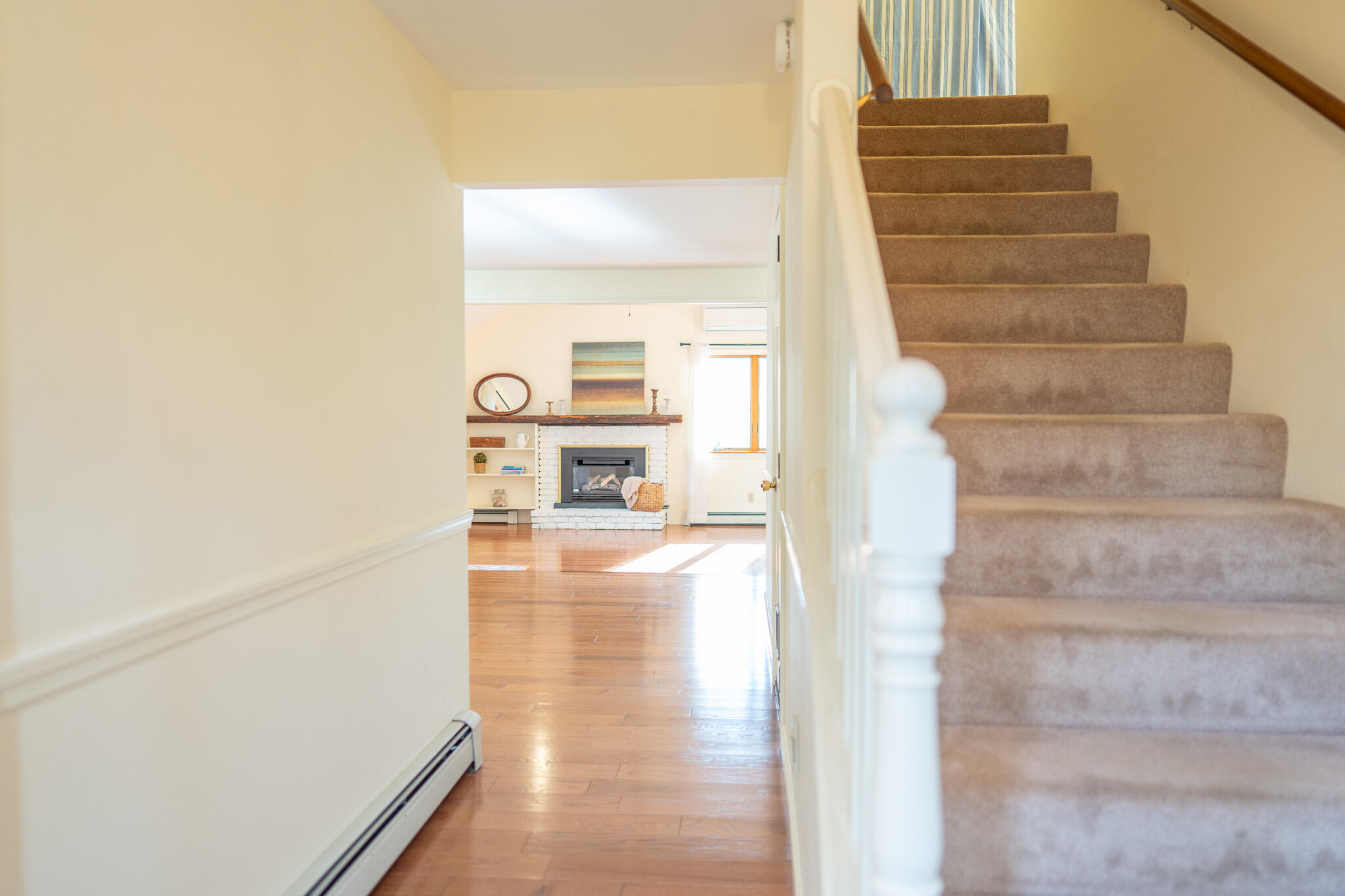 147 Brook Trail Road Brewster, MA 02631 - Photo 22 of 43 a view of a hallway with wooden floor and staircase