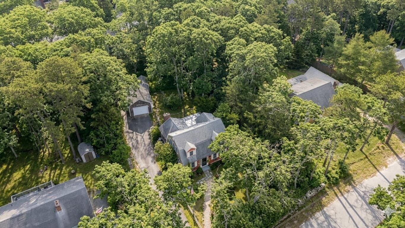 147 Brook Trail Road Brewster, MA 02631 - Photo 39 of 43 an aerial view of a house with a yard and tree s