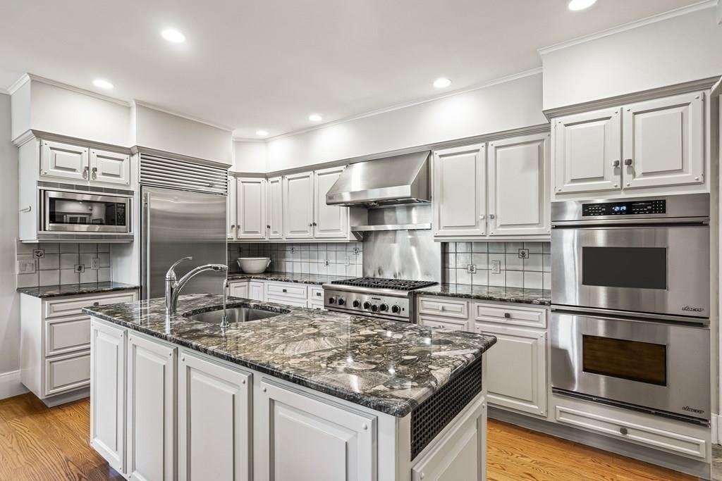 62-66 Temple Road Wellesley, MA 02482 - Photo 13 of 36 a kitchen with stainless steel appliances granite countertop a sink stove and refrigerator