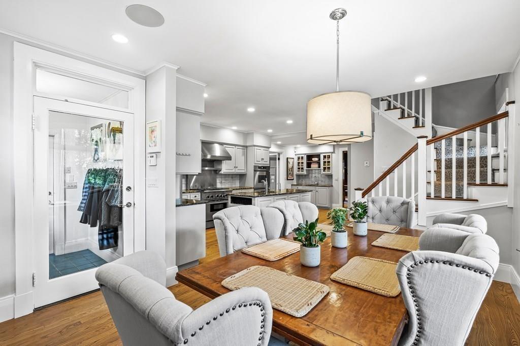 62-66 Temple Road Wellesley, MA 02482 - Photo 14 of 36 a view of a dining room and livingroom with furniture wooden floor a chandelier